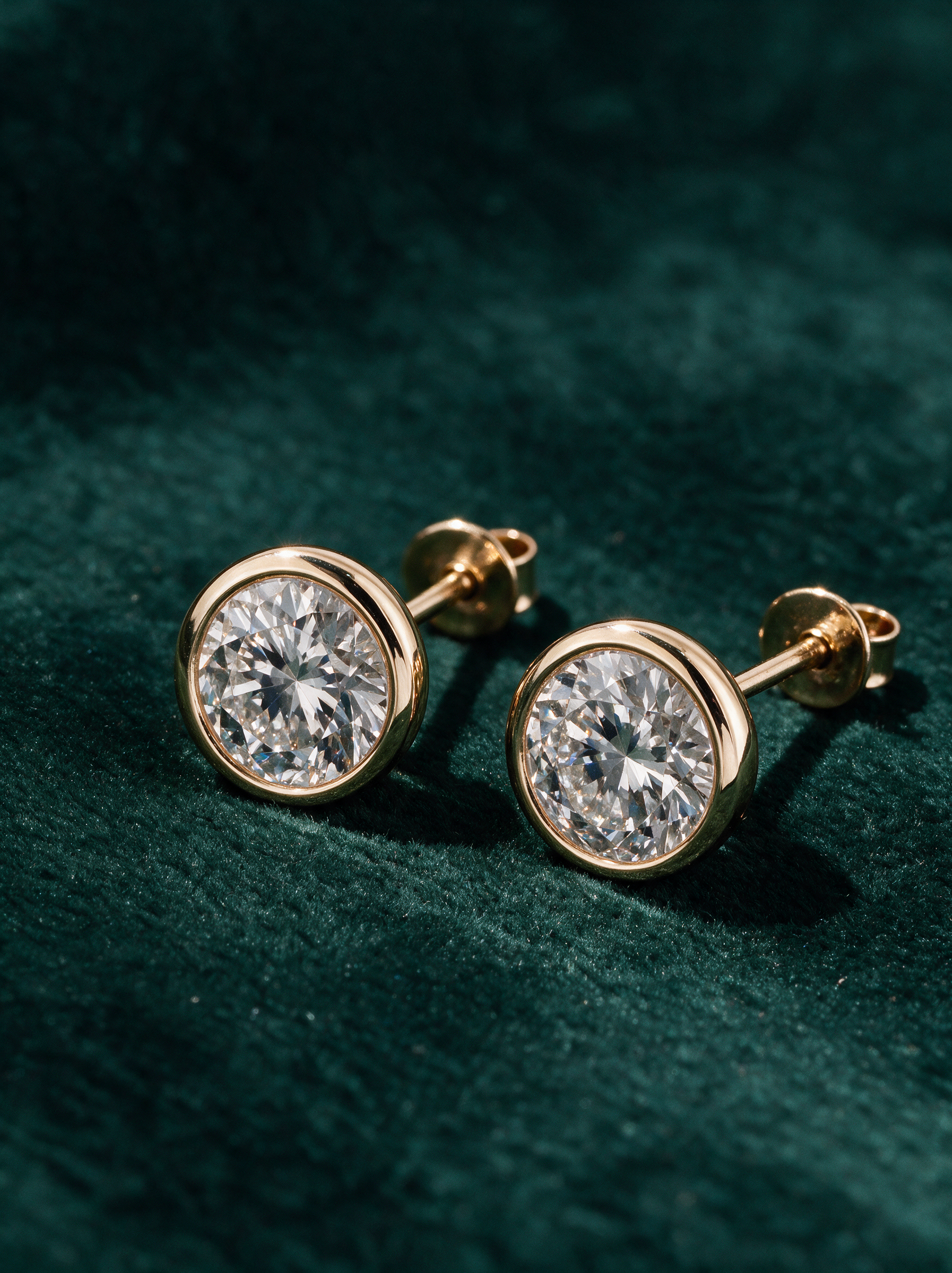 Round Bezel Studs — hero view, 0.50 ct total per pair · 14k yellow gold